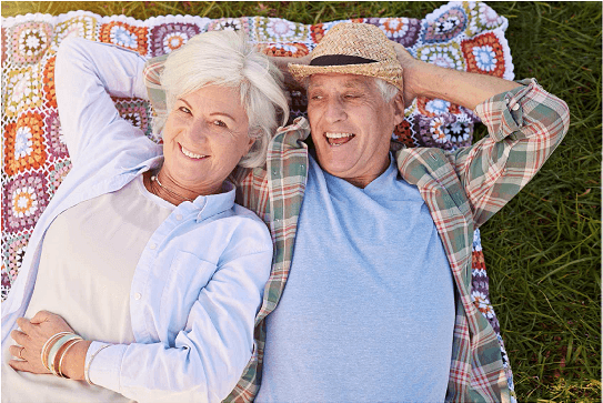 MAn and woman sleeping on the ground