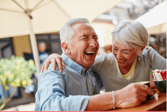 old man and woman laughing