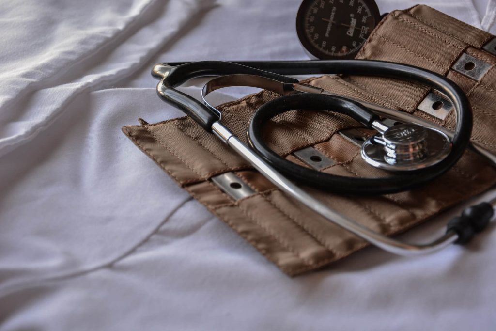 stethoscope placed on a white surface