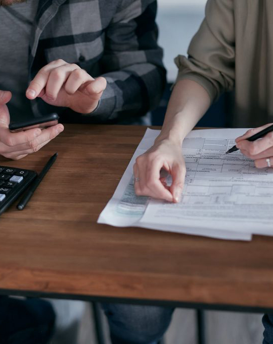 two-people-working-on-taxes-1024×682